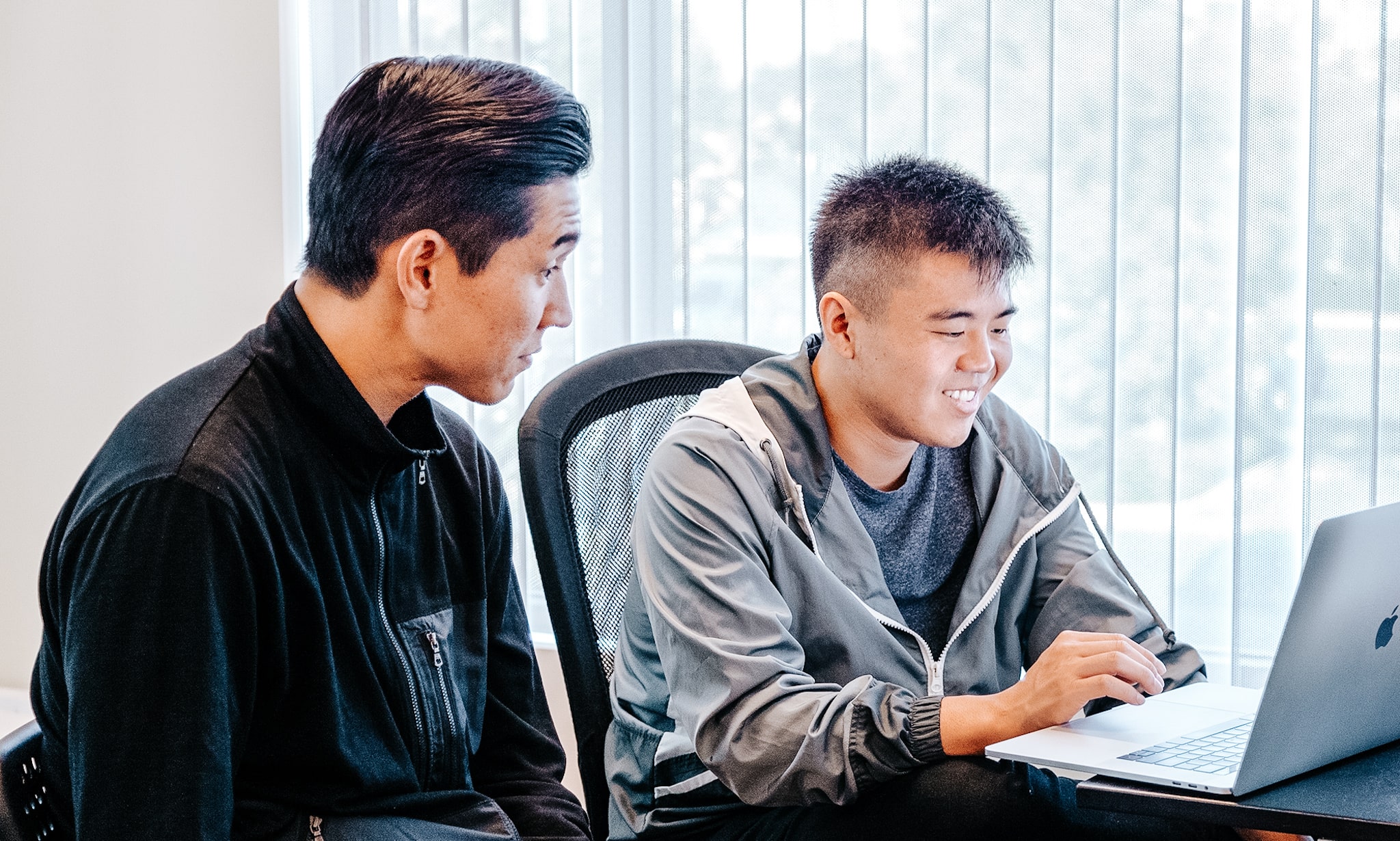 coding teacher explaining student